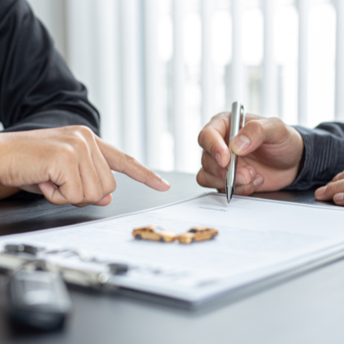 Insurance Broker Insurance brokers signing a form.