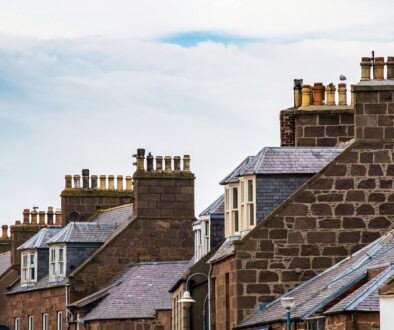 street of houses with chimneys.