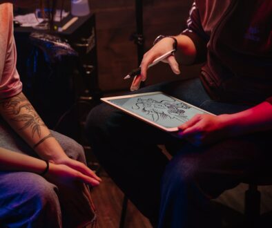 tattoo artist designing a tattoo