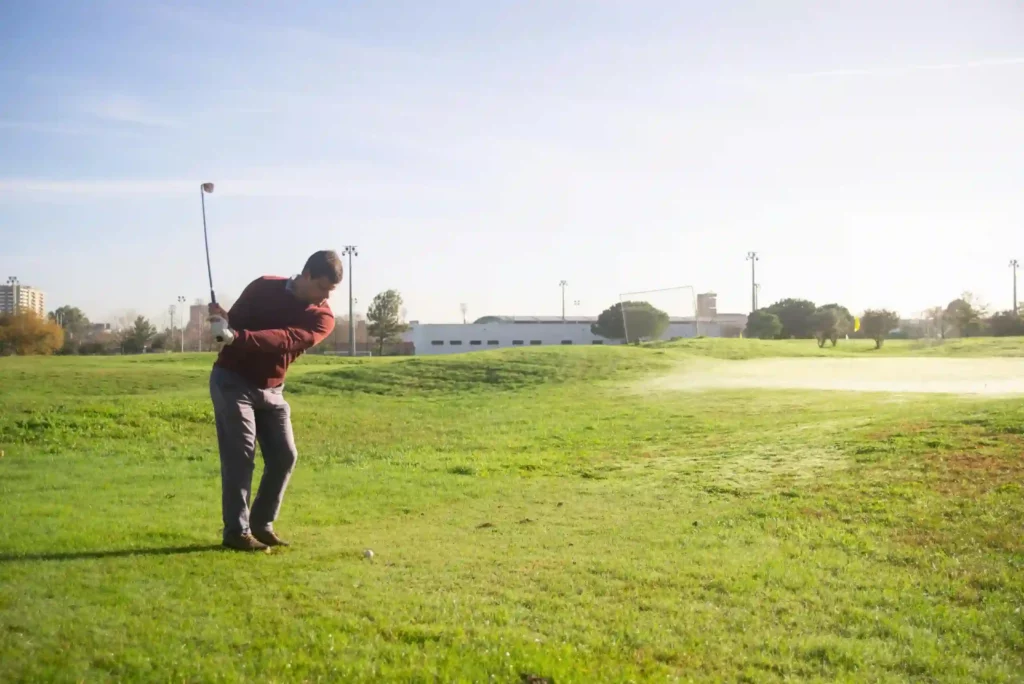 Man playing golf on a golf course